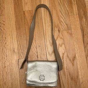 Tory Burch silver leather shoulder bag.Denting on bag & strap.Priced accordingly